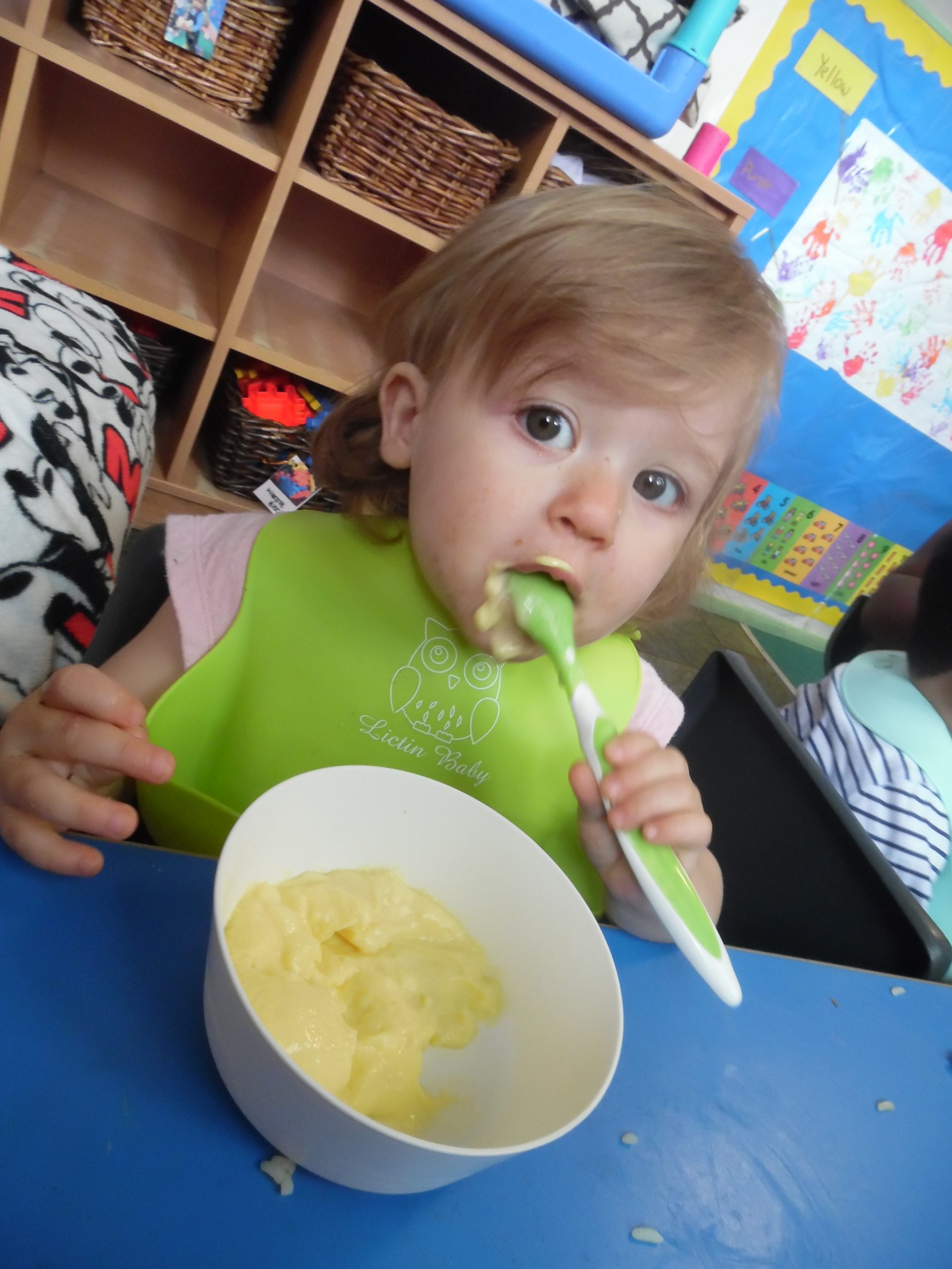 Nursery child eating food